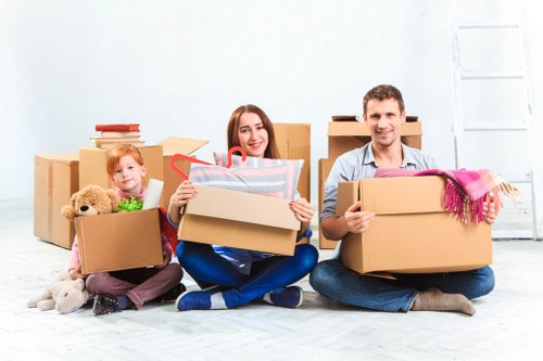 Packing and labeling office items for a move in Hire