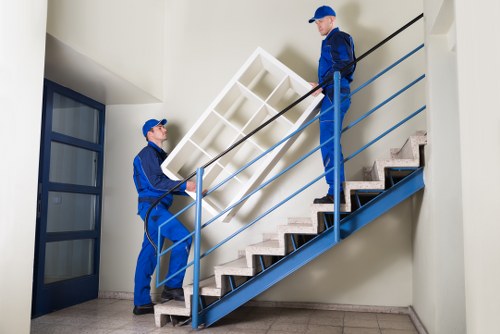 Local moving team organizing boxes for Hire customers