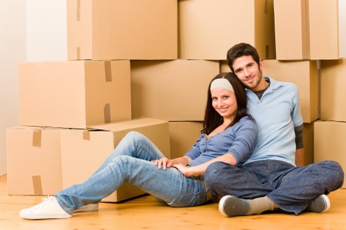 Packed office boxes and furniture ready for transport in Hire