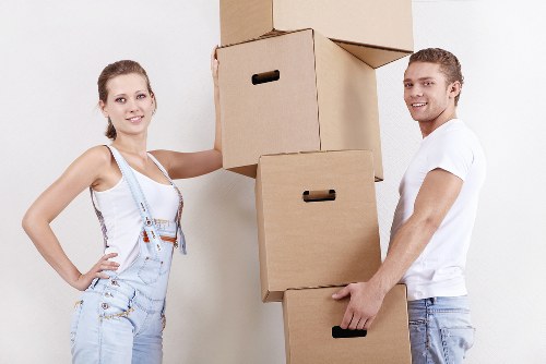 Packed boxes and furniture prepared for collection by a man with van in Hire