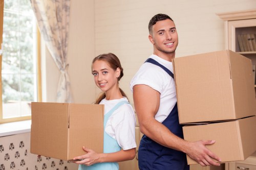 Local movers navigating parking and access challenges on a residential street
